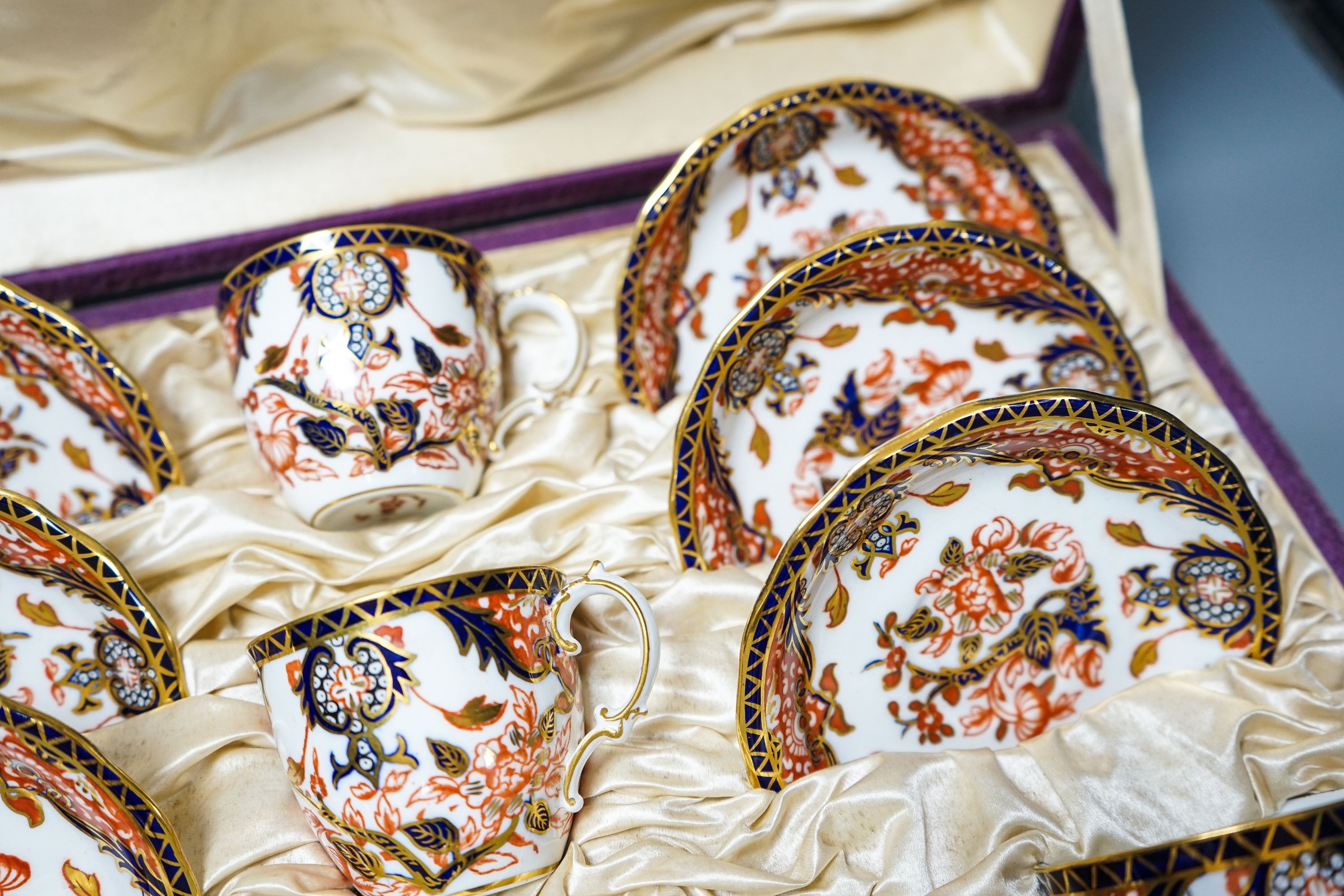 A cased Crown Derby Imari pattern coffee service